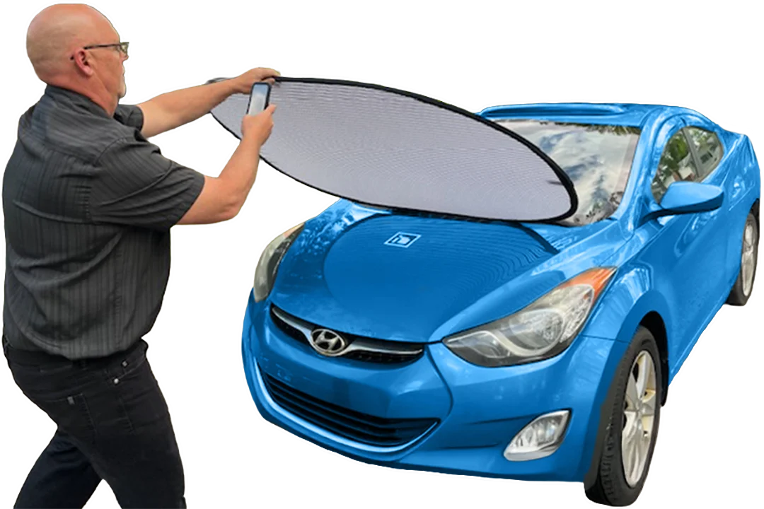 Man taking photo of hail damage with phone